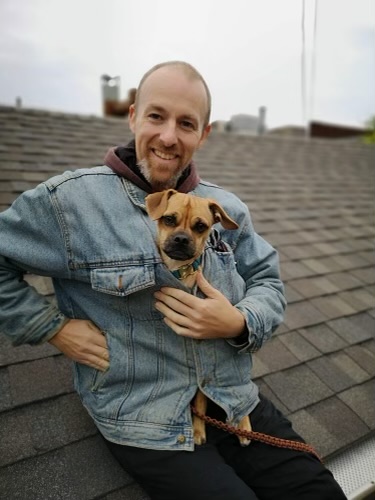 Image of the author with his dog